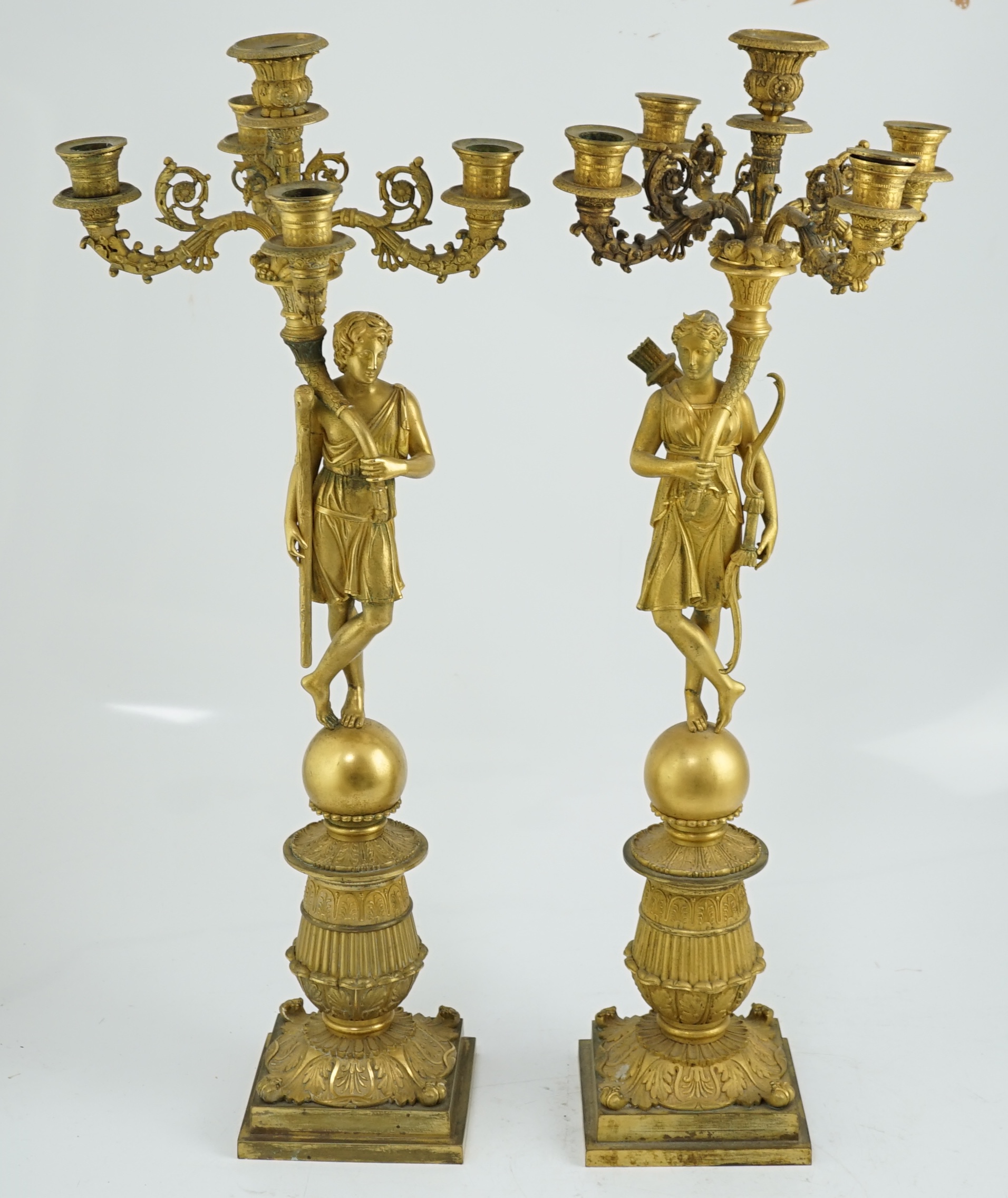 After Pierre-Philippe Thomire (1751-1843), a pair of Regency French Empire five light candelabra 25cm wide, 64cm high